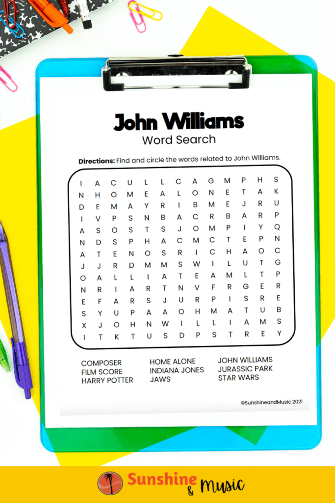 John Williams word search on a blue clipboard.