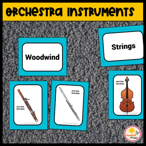 orchestra instrument sorting cards with colored pictures of a bassoon and flute under a card labeled woodwinds and a string bass under a card labeled strings
