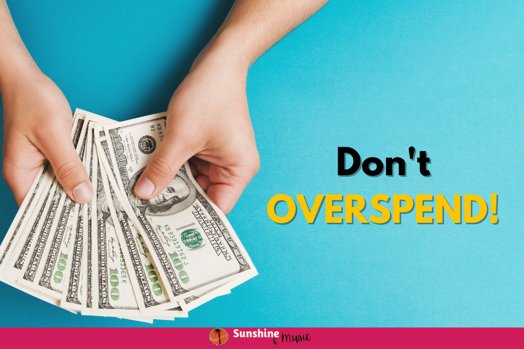 blue background with hands holding money. text: don't overspend